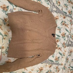 Knit sweater.